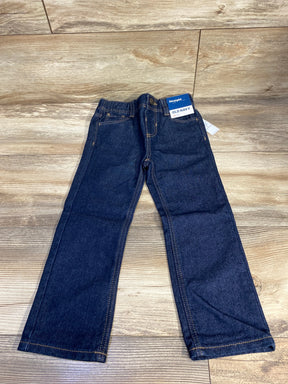Kids dark wash straight leg jeans with yellow stitching on wood floor