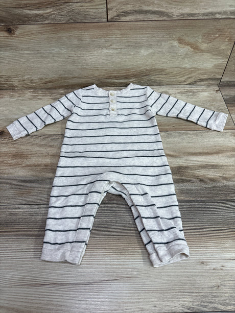 Front view of Old Navy beige Henley waffle knit coverall with dark horizontal stripes and button placket on wood-look flooring