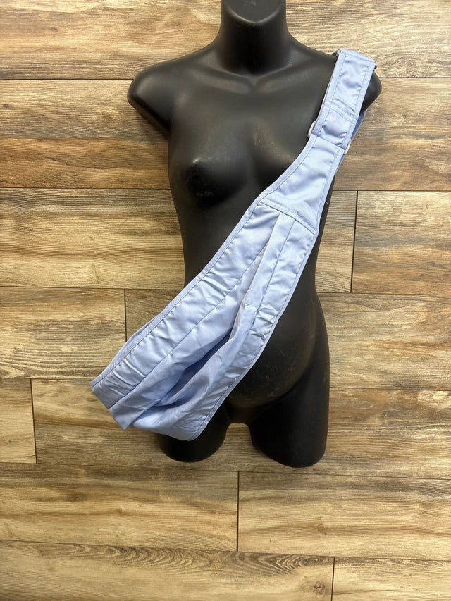 Front view of blue BHFIKL sling carrier showing single-shoulder pouch and padded strap on black mannequin, wood background