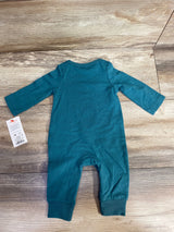 Teal long-sleeve newborn baby onesie with footless legs laid flat on wooden surface, resale clothing