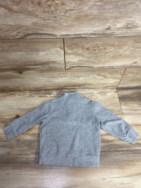 Back view of a gray long-sleeve baby sweater on wooden floor, kids clothing resale