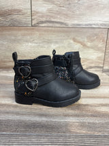 Black toddler boots with glitter sides, heart buckles, and side zipper for easy wear.