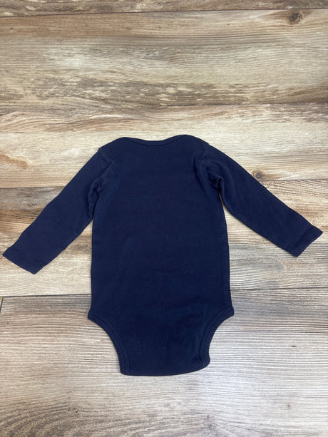 Back view of Carters navy long sleeve bodysuit in size 12 months on a wood grain background
