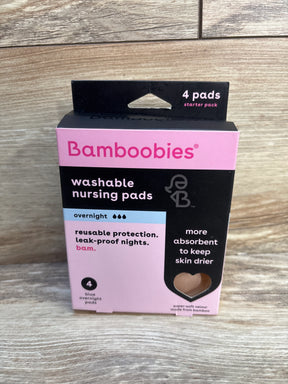 Bamboobies washable nursing pads 4-pack, overnight reusable breast pads on wood background