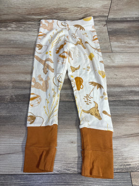 Kids leggings with western print and brown cuffs on wooden floor