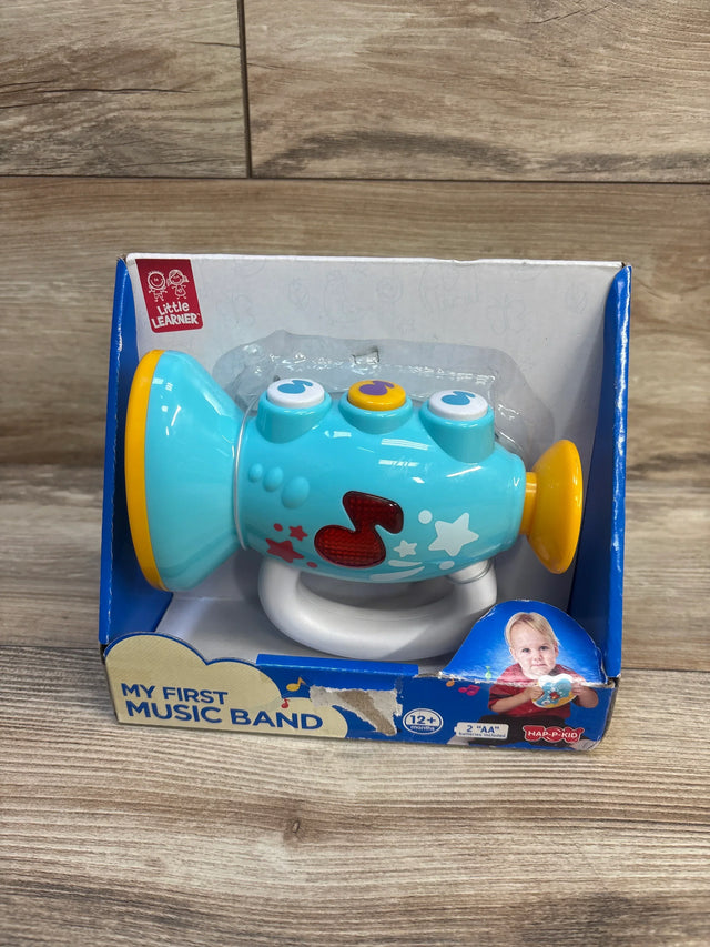 Blue toy trumpet for toddlers, My First Music Band, in box on wood floor, for ages 12 months and up