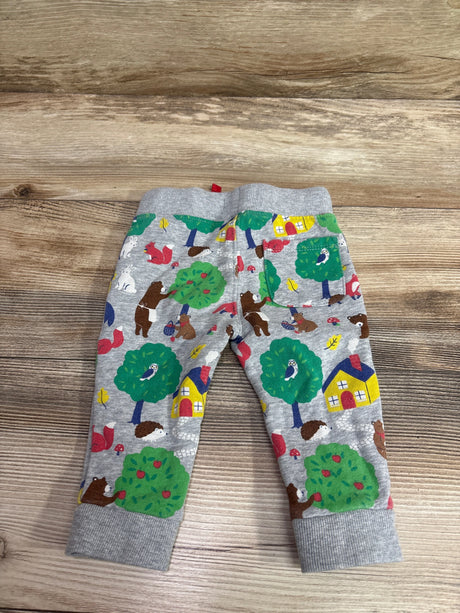 Front view of Mini Boden Woodland Animal Drawstring Joggers in grey, showcasing woodland print and ribbed cuffs on wood