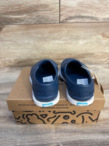 Blue slip-on kids shoes on a shoebox, eco-friendly children's footwear
