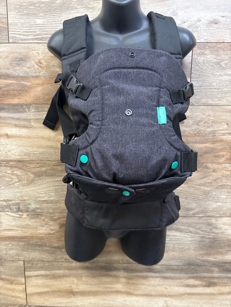 Front view of Infantino Flip 4-in-1 Convertible Baby Carrier showcasing padded straps and adjustable buckles on a mannequin