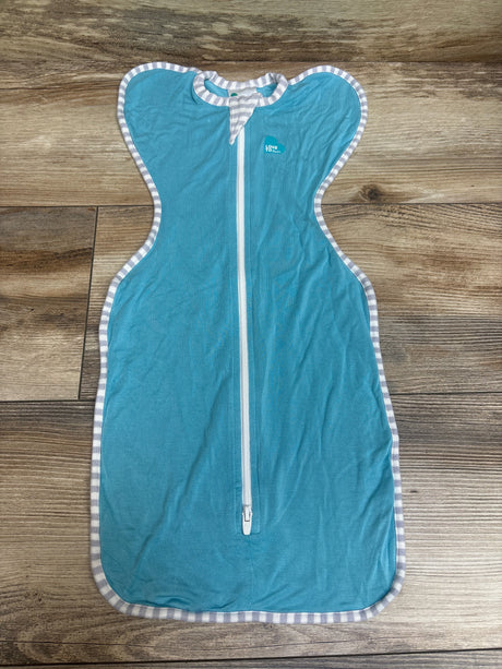 Front view of Love To Dream Swaddle Up Viscose in blue showcasing full-length zipper and striped trim on wood