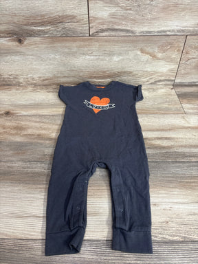 Front view of Cat and Jack gray baby jumpsuit with orange heart Loved graphic and snap leg openings on wood background