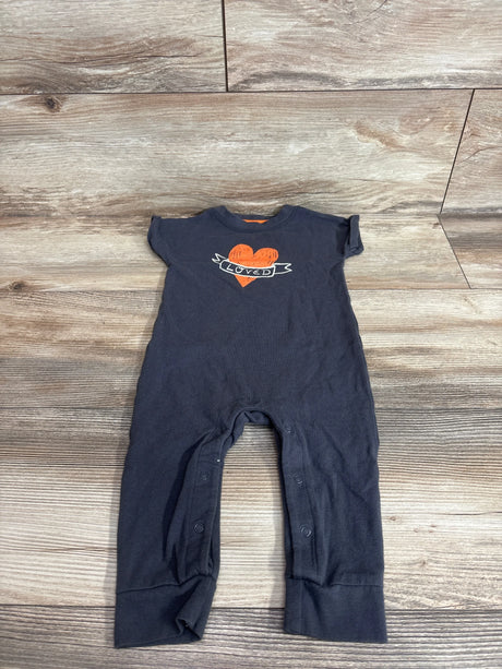 Front view of Cat and Jack gray baby jumpsuit with orange heart Loved graphic and snap leg openings on wood background