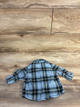 Back view of blue Old Navy plaid button-up shirt showing collar and rolled cuffs, size 0-3 months on wood background
