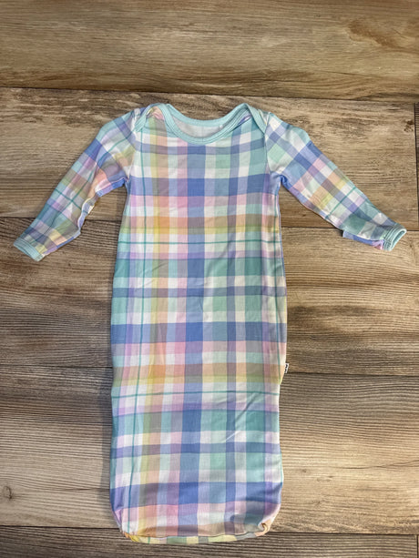 Flat lay of Little Sleepies newborn convertible bamboo sleep gown showing pastel plaid print and long sleeves on wood background