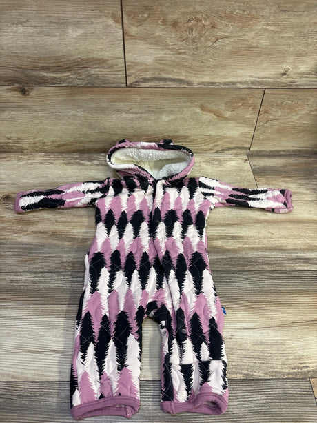 Front view of pink Kickee Pants hooded pram coverall with black and white pattern and front snaps on wood floor
