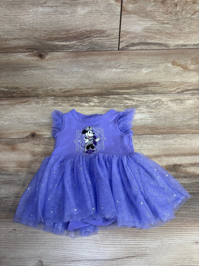 Purple toddler dress with tulle skirt and cartoon character, wood background