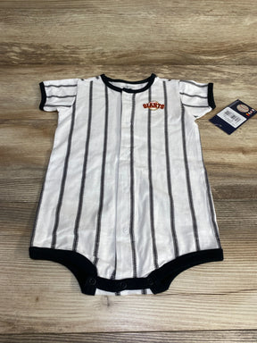 Flat lay of white San Francisco Giants pinstripe romper (24M) showing front snaps, black trim and chest Giants patch on wood background