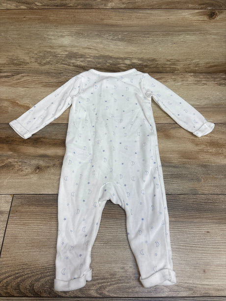 Front view of Child of Mine white sleeper in size 3 to 6 months, showcasing moon and star print and long sleeves on a wood background