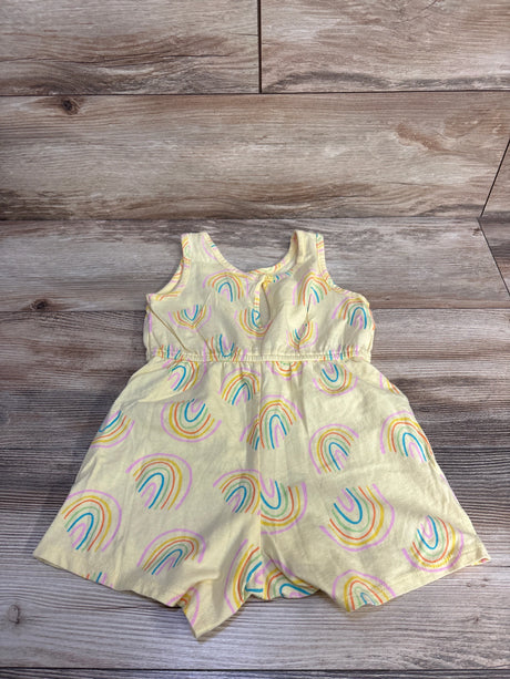 Flat lay of yellow Old Navy sleeveless shortie romper (5T) showcasing rainbow print and elastic waist on light wood background