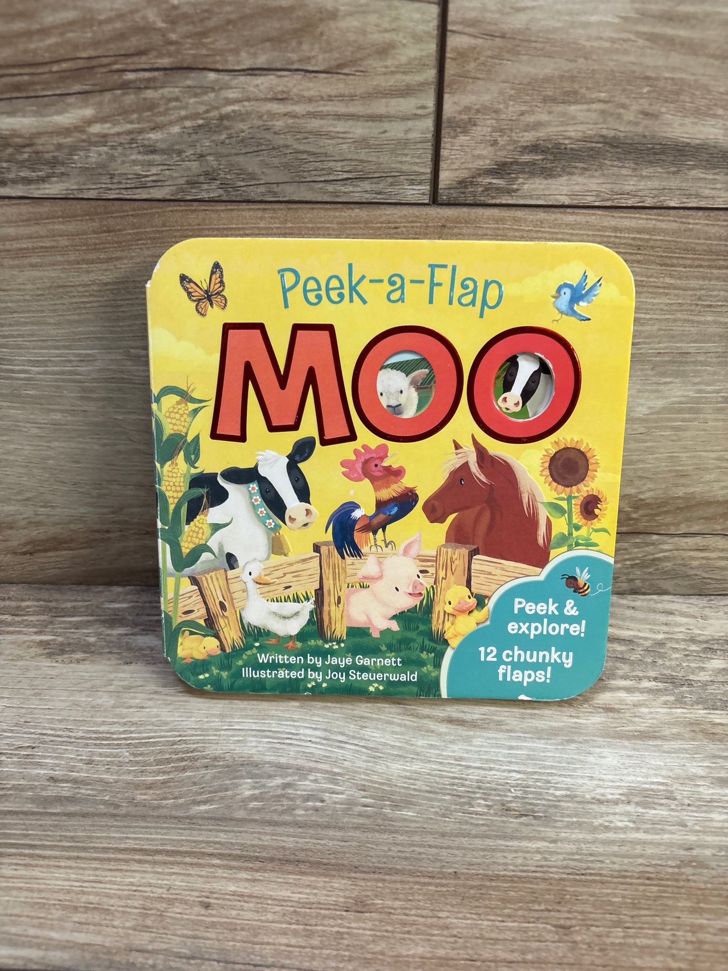 Moo: Peek-a-Flap Board Book