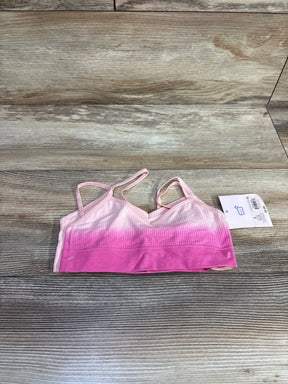 Pink ombre ribbed bralette with spaghetti straps on wood background, product tag attached