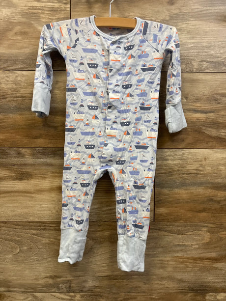 Front view of Magnetic Me Forever & All Waves blue modal convertible footie with boat print on wood
