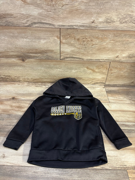 Front view of a black Golden Knights pullover hoodie with hood and team logo on a wood-look floor