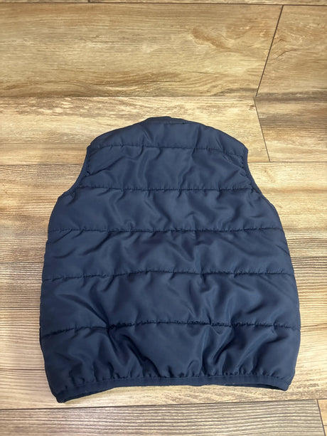 Back view of Tommy Hilfiger Colorblock Puffer Sherpa Vest in navy, showing quilted puffer sections and elasticized hem