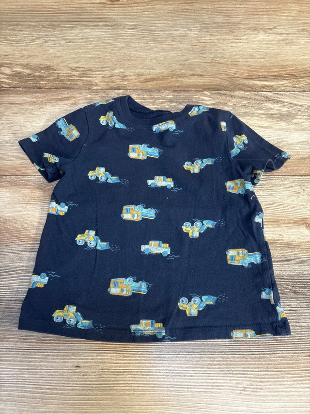 Navy blue toddler t-shirt with yellow construction truck print, displayed on wood background