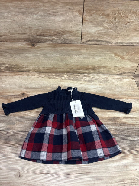 Front view of EMC navy knit flannel dress, size 3 months, showcasing long sleeves and plaid skirt with wood floor background