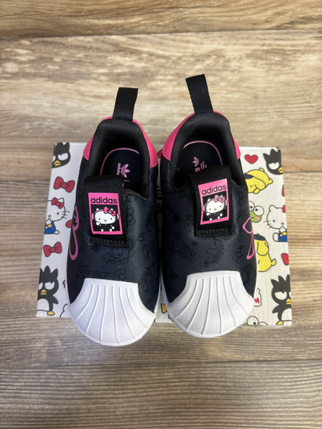 Top view of Adidas x Hello Kitty Superstar 360 shoes showing white shell-toe and Hello Kitty tongue patches on patterned box