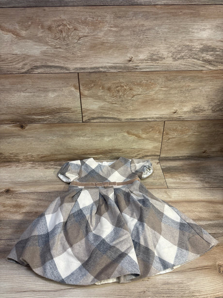 Top-down view of Mayoral beige plaid wool-blend dress showcasing short sleeves, belted waist, and flared skirt on a wood floor