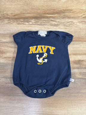 Top-down view of navy baby bodysuit 3-6 months showing yellow NAVY text and anchor graphic, puff sleeves and three snap closures on wood background