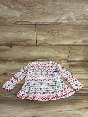 Front view of Okie Dokie unicorn peplum shirt, white 24M, showing rainbow, unicorn and heart print on wood floor