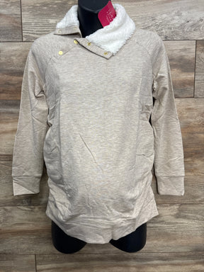 Light beige long-sleeve pullover with white sherpa collar and gold snap buttons on black mannequin