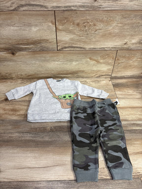 Toddler outfit with Baby Yoda graphic sweatshirt and camo print jogger pants on wood floor
