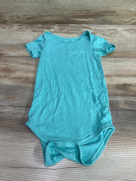 Light blue Kyte Baby bamboo bodysuit for babies size 18-24m on a wooden background