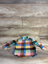 Front view of multicolored toddler flannel button-up shirt size 3T showcasing chest pocket and blue buttons on wood floor background