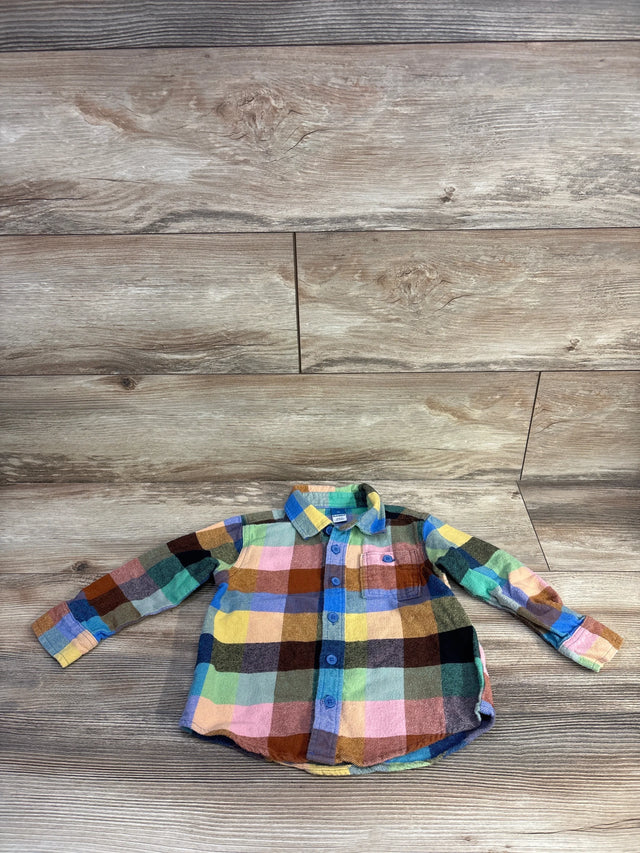 Front view of multicolored toddler flannel button-up shirt size 3T showcasing chest pocket and blue buttons on wood floor background