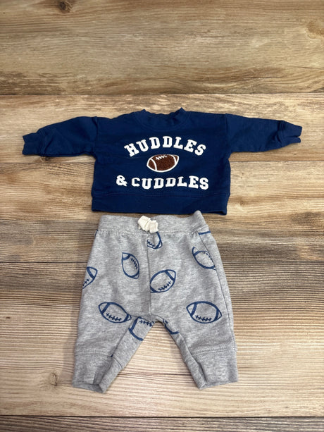 Front view of Just One You Huddles & Cuddles 2pc navy sweatshirt and gray pants set with football graphics