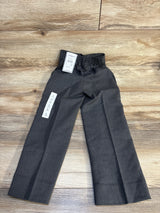 Gray slim-fit boys pants with elastic waist, size 5, laid on wood floor