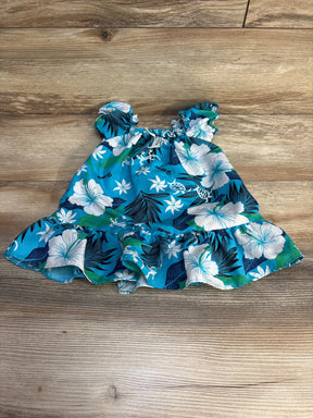 Flat lay of Koko Keiki blue toddler floral dress showcasing shirred elastic neckline and ruffled hem on wood floor