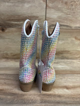 Back view of glittery multicolor girls' cowboy boots with wooden heels on wooden floor