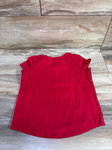 Back view of red Minnie and Daisy toddler shirt size 5T showing ruffled sleeves and curved hem on wood background