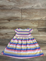 Carter's striped baby girl dress with short sleeves, colorful rainbow pattern, laid on wood floor