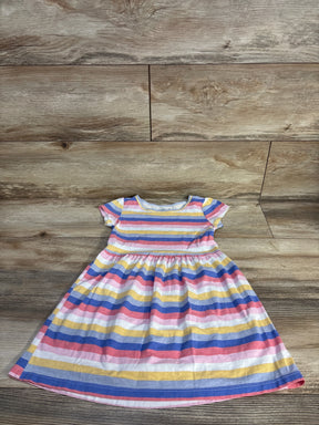 Carter's striped baby girl dress with short sleeves, colorful rainbow pattern, laid on wood floor