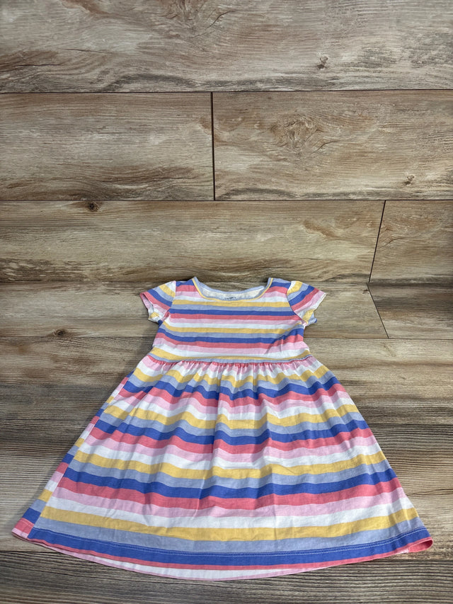 Carter's striped baby girl dress with short sleeves, colorful rainbow pattern, laid on wood floor