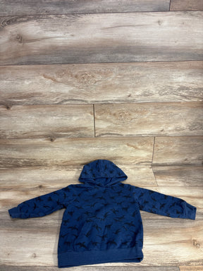 Navy blue kids hoodie with black dinosaur print laid flat on wood background