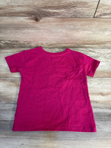 Bright pink kids short sleeve t-shirt on wood floor, perfect for casual wear or resale