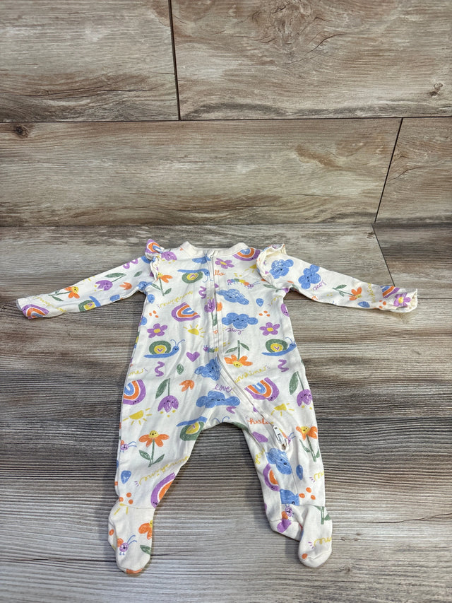 Front view of Old Navy newborn footed sleeper in beige with rainbow, cloud and flower print and ruffle shoulders on wood floor